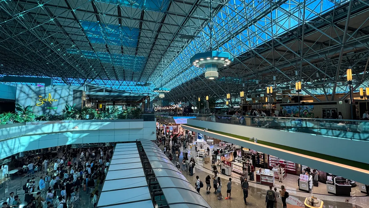 Departure area and upper gallery in Taoyuan Airport Terminal 2, photographed in July 2026